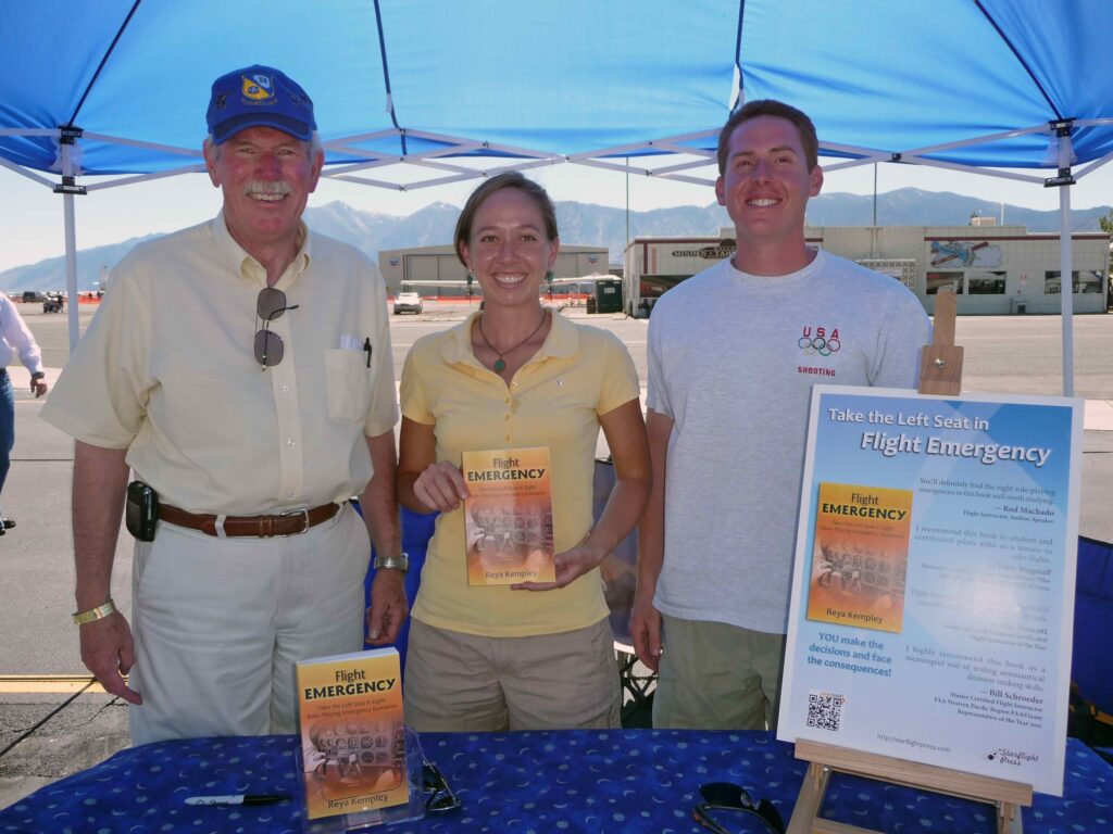 Bill Schroder, left, Master Certified Flight Instructor, with Reya and Tarl Kempley